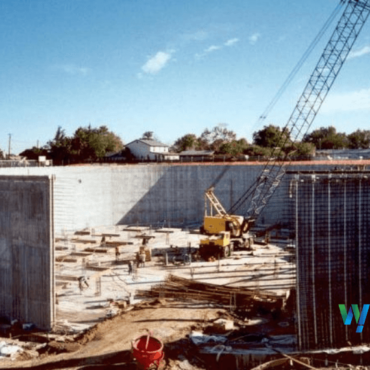 Photo of water storage tank under construction with crane