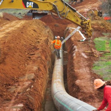 Photo of sewer pipeline and trench under construction