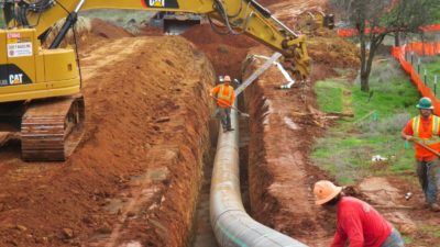 Photo of sewer pipeline and trench under construction