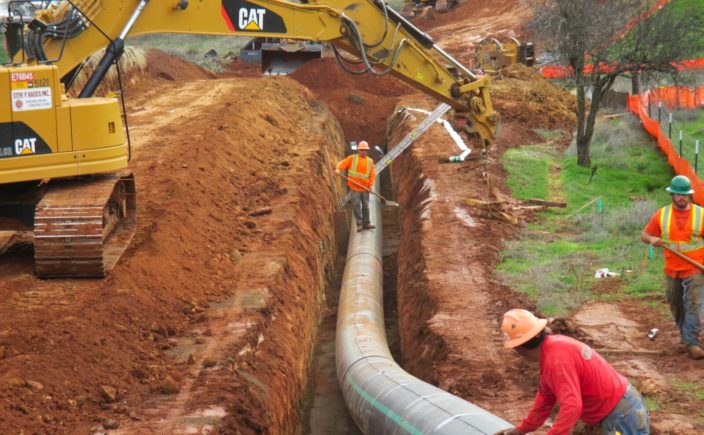 Photo of sewer pipeline and trench under construction