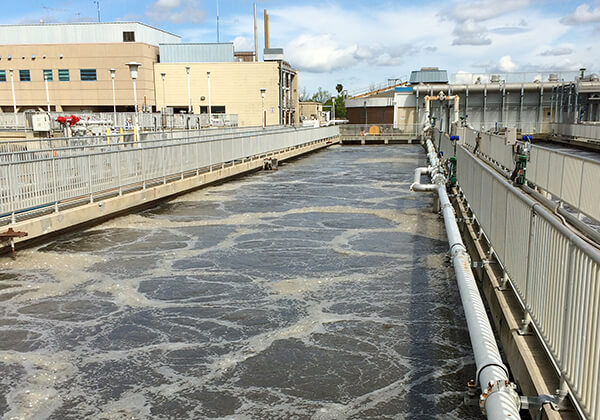 Secondary treatment basin with agitated wastewater.