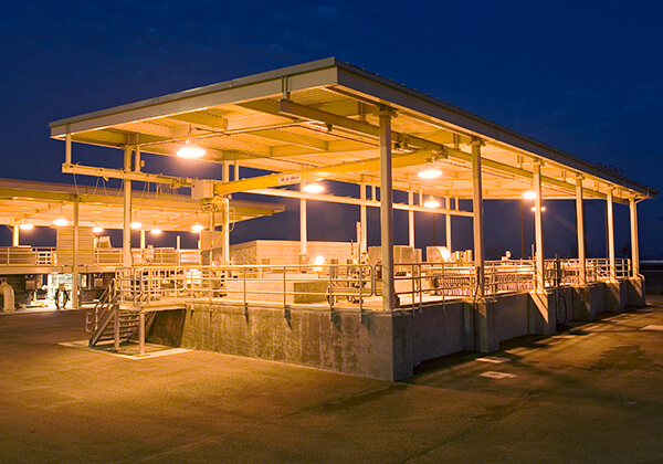 Water pollution and control facility lit up at night.