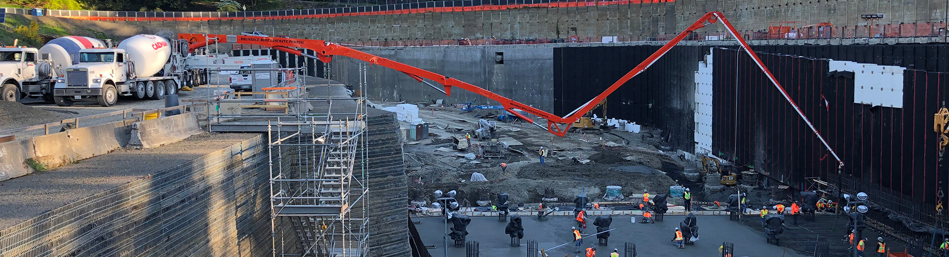 Aerial image from the Portland Water Bureau's Washington Park construction site showing cement preparation and pouring with a large construction crew