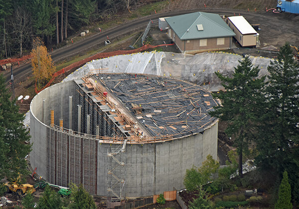 aerial photo of Grabhorn Reservoir under construction with half of roof installed