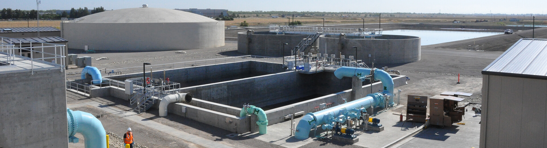 Woodland-Davis Clean Water Agency water treatment plant large water pipes and storage tank