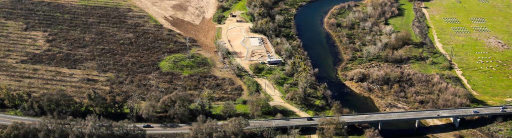 SRWA aerial of river, farmland, job site, and freeway